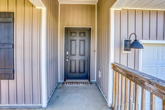 doorway to property featuring board and batten siding