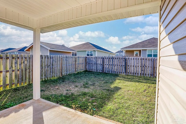 view of yard with a patio area and a fenced backyard