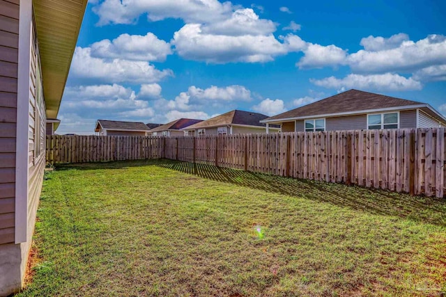 view of yard with a fenced backyard