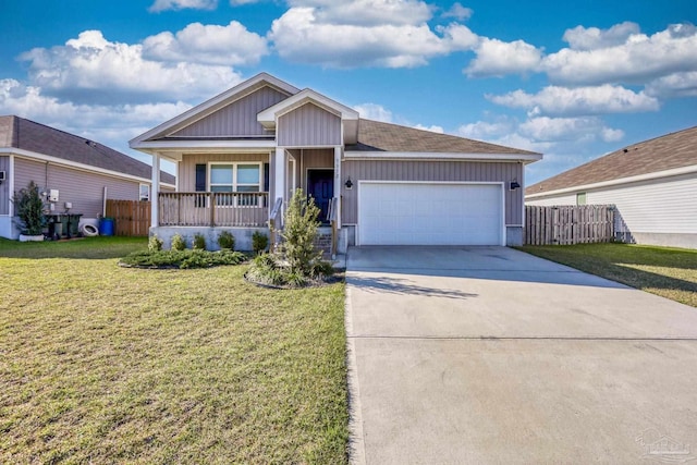 ranch-style home with a porch, a garage, fence, driveway, and a front yard