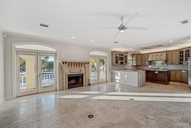 kitchen with stainless steel fridge, decorative backsplash, ornamental molding, ceiling fan, and french doors