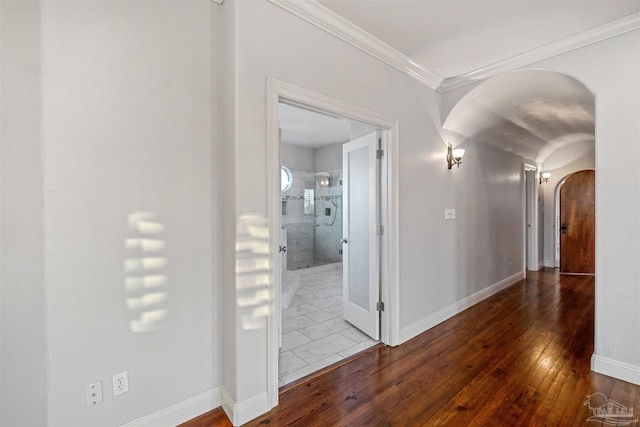 hall with crown molding and hardwood / wood-style floors