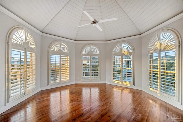 unfurnished sunroom with ceiling fan and vaulted ceiling