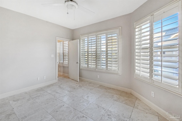 spare room featuring ceiling fan