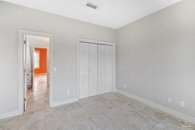 unfurnished bedroom featuring a closet