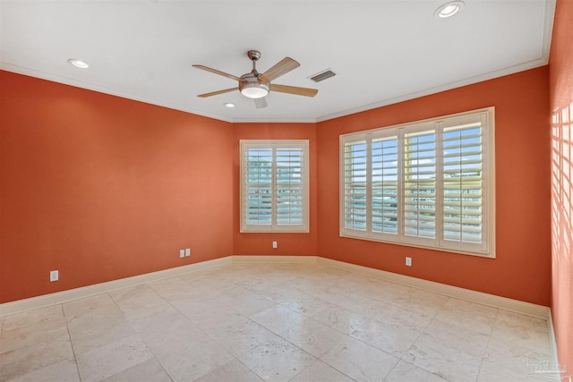 spare room with ornamental molding and ceiling fan