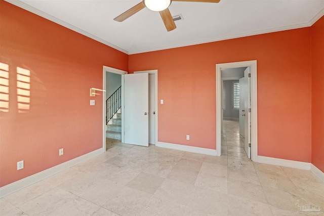 unfurnished bedroom featuring crown molding and ceiling fan