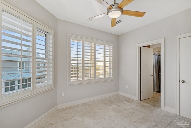 unfurnished room featuring ceiling fan