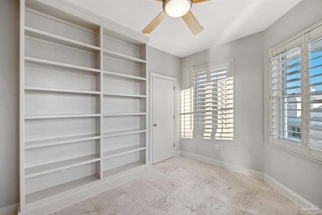 unfurnished bedroom featuring ceiling fan