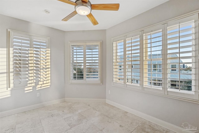 unfurnished room featuring ceiling fan