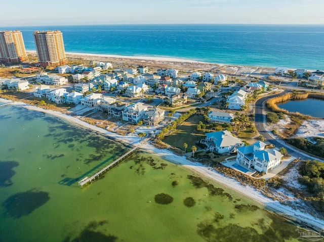 aerial view with a water view and a view of the beach