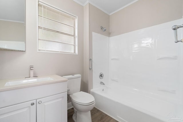 full bathroom featuring crown molding, vanity, toilet, and tub / shower combination