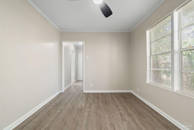 unfurnished room featuring ornamental molding, hardwood / wood-style floors, and ceiling fan