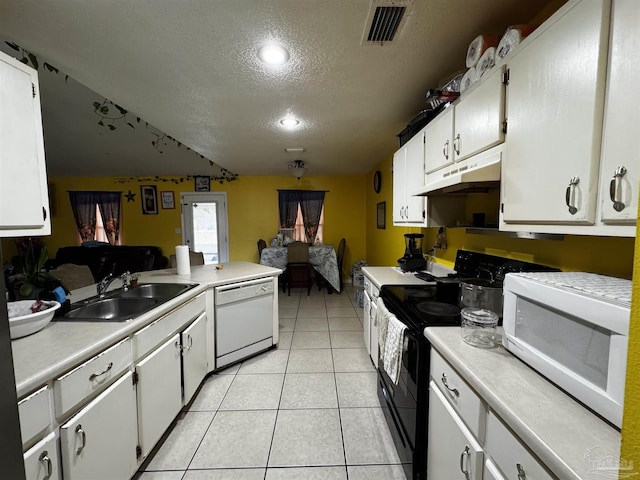 kitchen featuring a textured ceiling, white appliances, white cabinetry, and sink