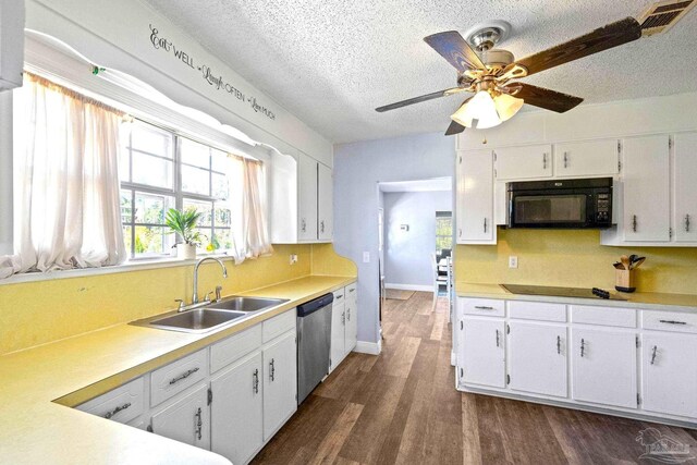 941 Summer Shade Ln, Cantonment, FL 32533 - kitchen with black appliances, a sink, a textured ceiling, and white cabinetry