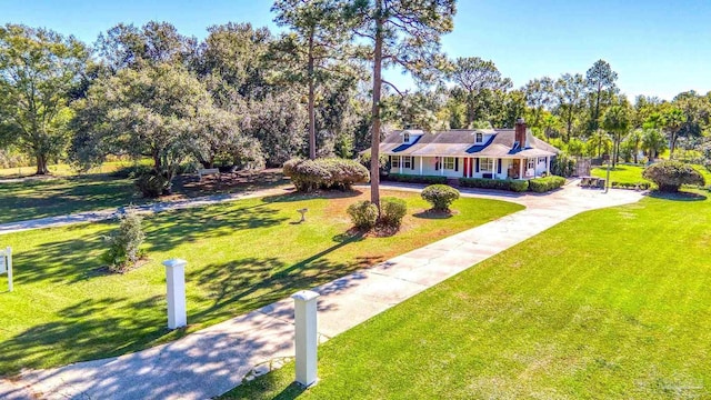 941 Summer Shade Ln, Cantonment, FL 32533 - view of front of home featuring a front yard, view of scattered trees, driveway, and a porch
