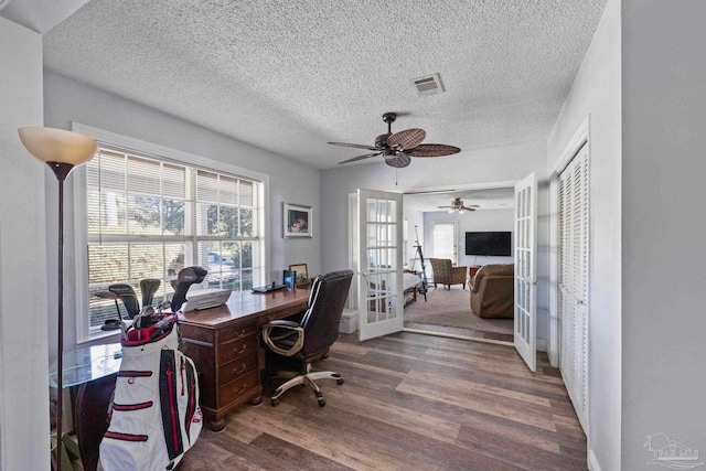 office featuring ceiling fan, french doors, a textured ceiling, and hardwood / wood-style flooring