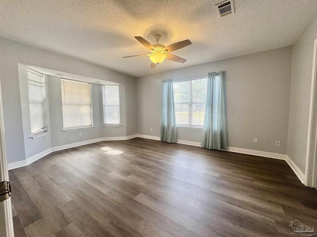 941 Summer Shade Ln, Cantonment, FL 32533 - empty room featuring a ceiling fan, dark wood finished floors, a textured ceiling, and baseboards
