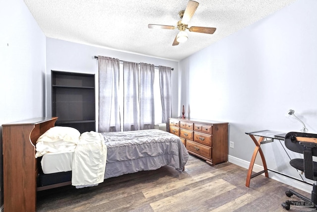 941 Summer Shade Ln, Cantonment, FL 32533 - bedroom featuring a textured ceiling, wood finished floors, ceiling fan, and baseboards