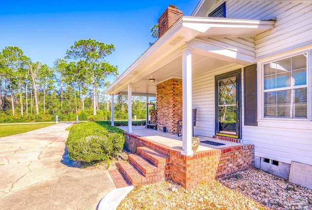 view of patio featuring a porch