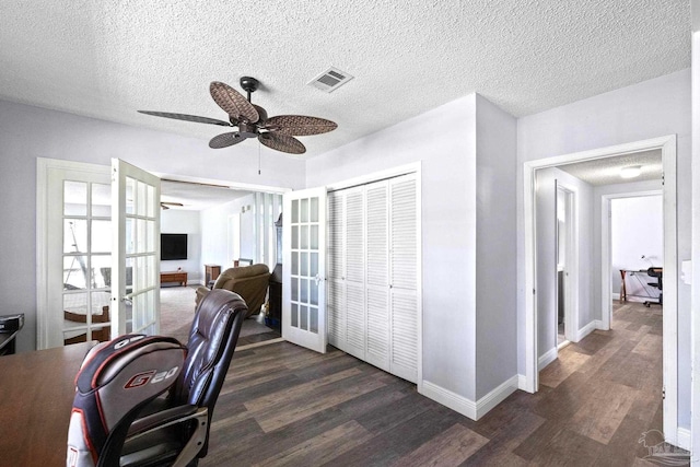 941 Summer Shade Ln, Cantonment, FL 32533 - office with french doors, dark wood finished floors, ceiling fan, baseboards, and a textured ceiling