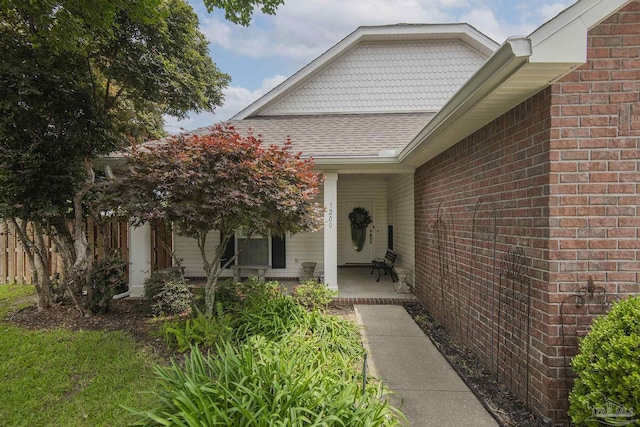 3200 Silverleaf Dr, Pensacola, FL 32504 - view of exterior entry with covered porch and brick siding