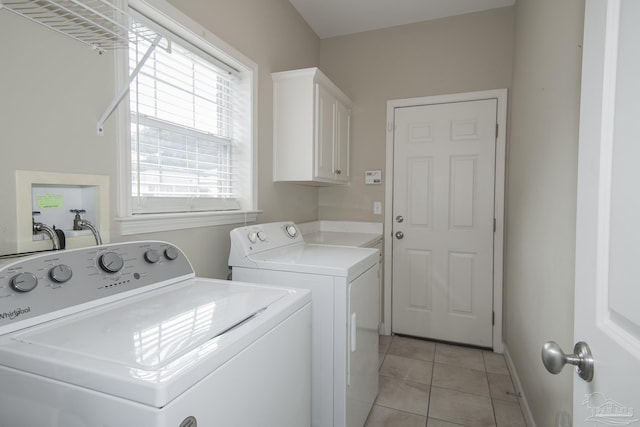 3200 Silverleaf Dr, Pensacola, FL 32504 - laundry area with cabinet space, separate washer and dryer, light tile patterned floors, and baseboards