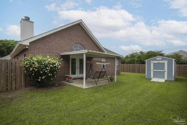 3200 Silverleaf Dr, Pensacola, FL 32504 - rear view of house with brick siding, french doors, a patio area, and a chimney