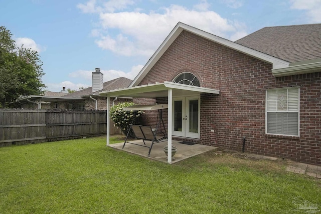 3200 Silverleaf Dr, Pensacola, FL 32504 - rear view of house featuring brick siding, roof with shingles, and a patio