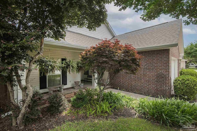 3200 Silverleaf Dr, Pensacola, FL 32504 - view of front facade featuring roof with shingles and brick siding