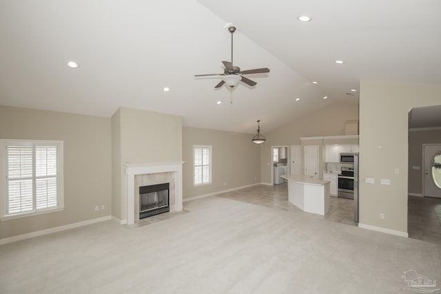 3200 Silverleaf Dr, Pensacola, FL 32504 - unfurnished living room featuring light colored carpet, ceiling fan, a tiled fireplace, baseboards, and recessed lighting
