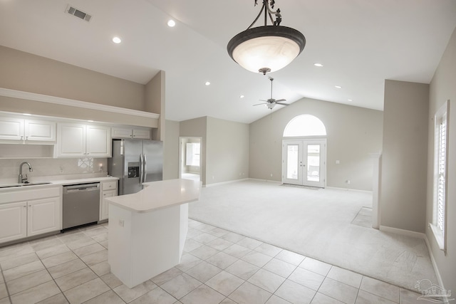 3200 Silverleaf Dr, Pensacola, FL 32504 - kitchen with appliances with stainless steel finishes, a sink, light carpet, a ceiling fan, and light countertops