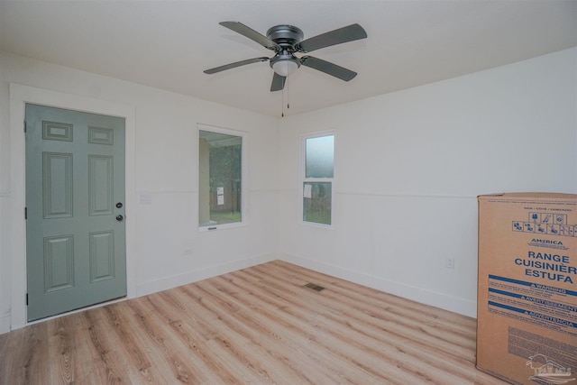 spare room featuring ceiling fan and light wood-type flooring