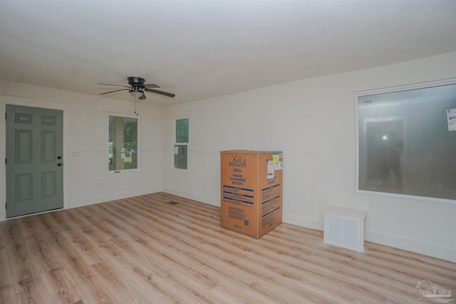 spare room with light hardwood / wood-style floors and ceiling fan