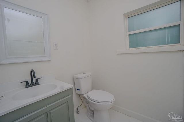 bathroom featuring vanity, toilet, and tile patterned floors