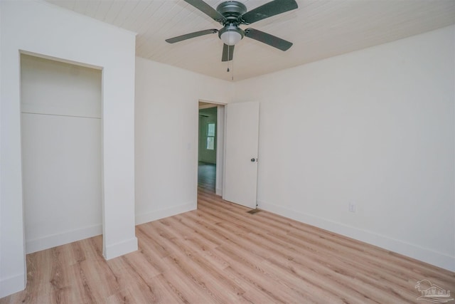 unfurnished bedroom with ceiling fan and light hardwood / wood-style flooring