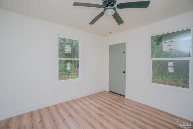 spare room with ceiling fan and light wood-type flooring