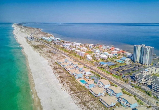 birds eye view of property featuring a view of the beach and a water view