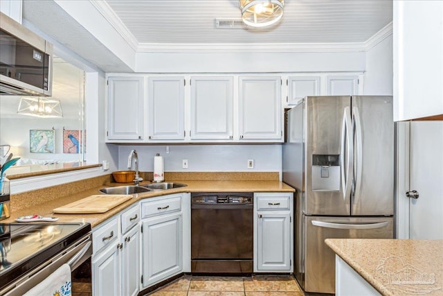 kitchen featuring crown molding, stainless steel appliances, light countertops, white cabinetry, and a sink