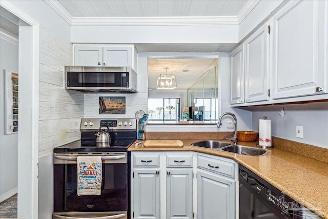 kitchen with stainless steel appliances, white cabinetry, a sink, and ornamental molding