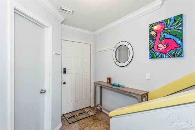 foyer entrance with visible vents and crown molding