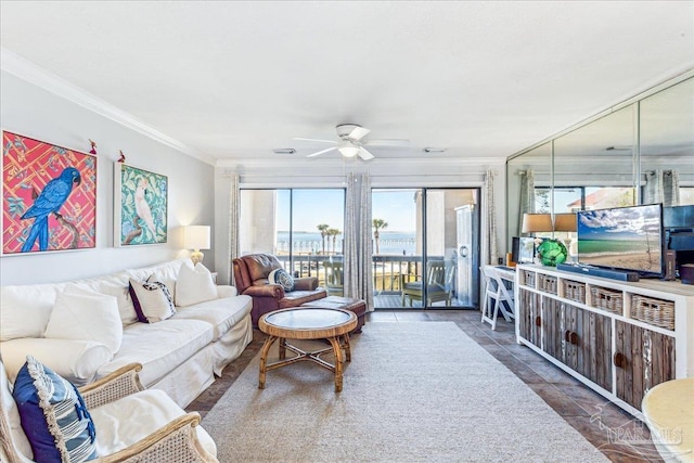 living area featuring ornamental molding, ceiling fan, and tile patterned floors