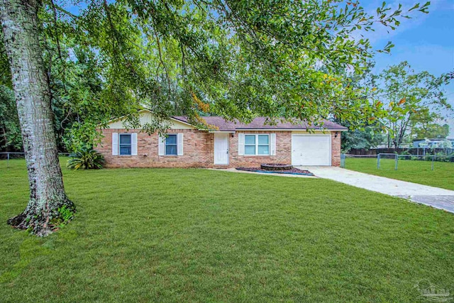 ranch-style home with a front yard and a garage