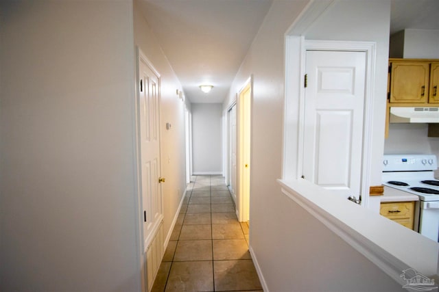 hallway featuring light tile patterned flooring