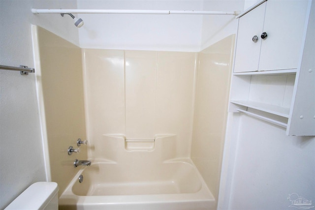 bathroom featuring toilet and shower / bathing tub combination