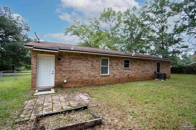 rear view of house with a yard