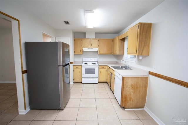 kitchen with white appliances, sink, and light tile patterned flooring