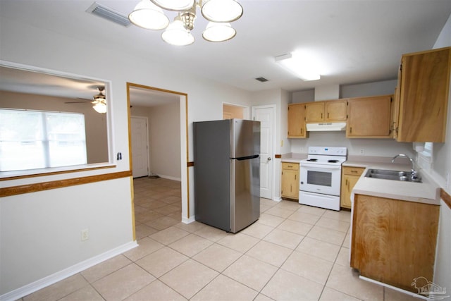 kitchen with stainless steel fridge, white electric range oven, light tile patterned floors, sink, and ceiling fan with notable chandelier