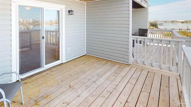 deck featuring a water view