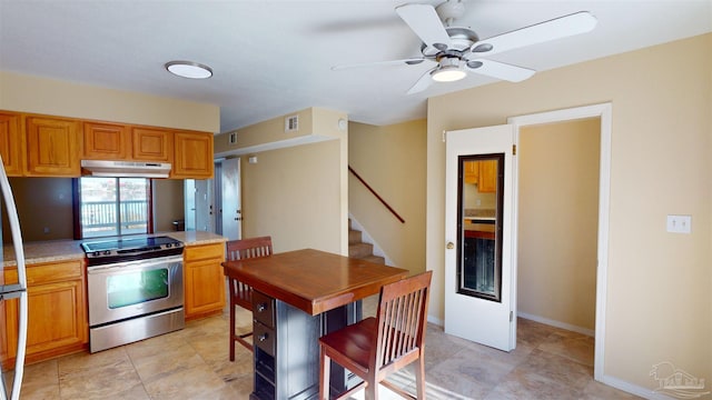 kitchen with ceiling fan and stainless steel electric range oven